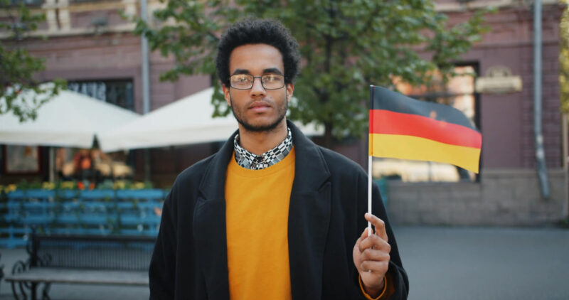 Man Waiving Flag of Germany